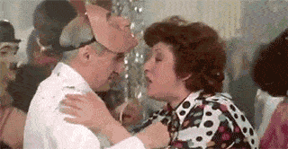 photo-man-wearing-mask-talking-to-woman.gif